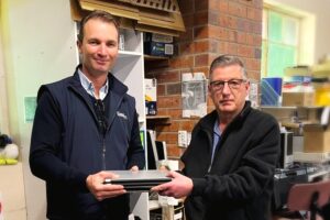 Steve Shotton from RDA handing over used laptops to Ian Paschke from ITShare.