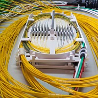 Coils of fibre optic cable leading into connections.